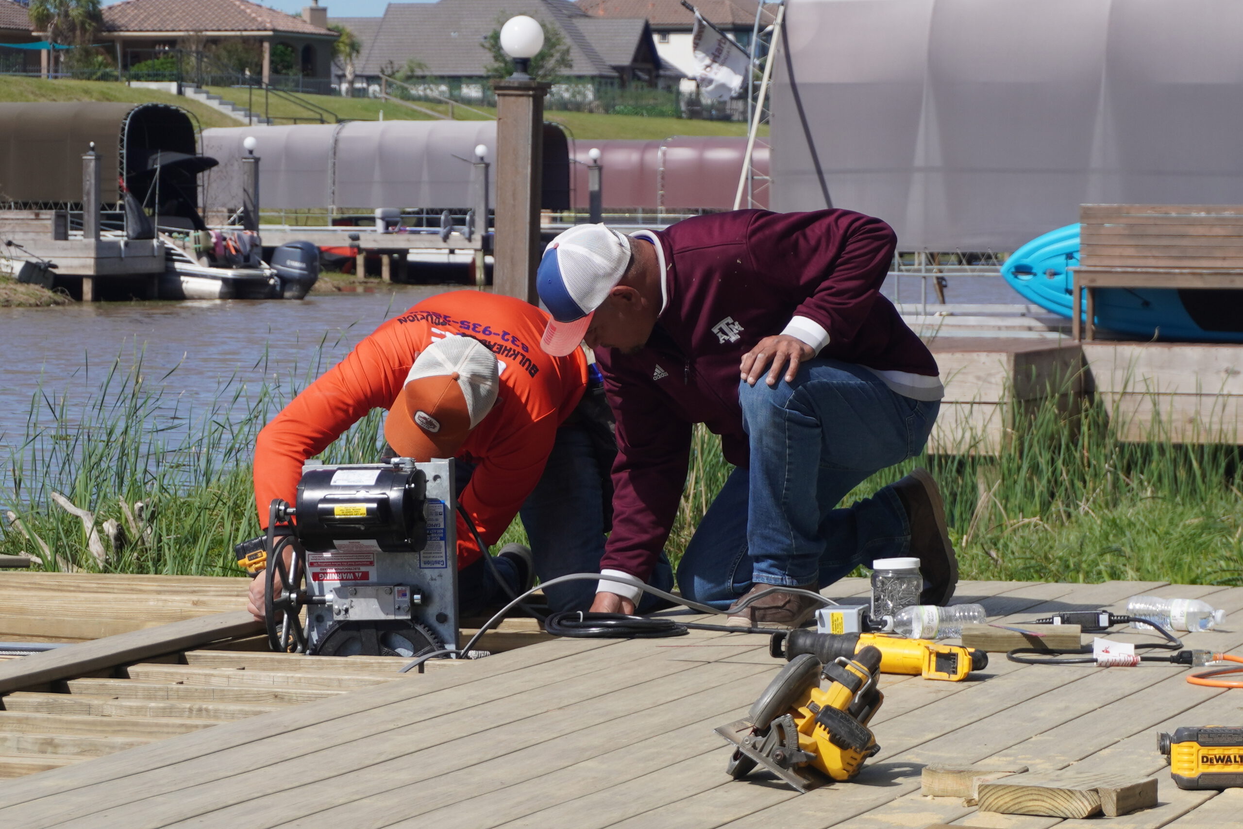 dock repair Lake Conroe — crew installing dock boards close up